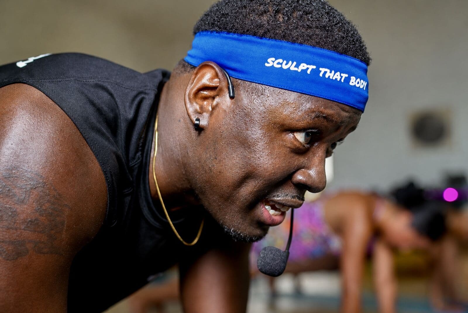Jamarr coaching a sculpt yoga class
